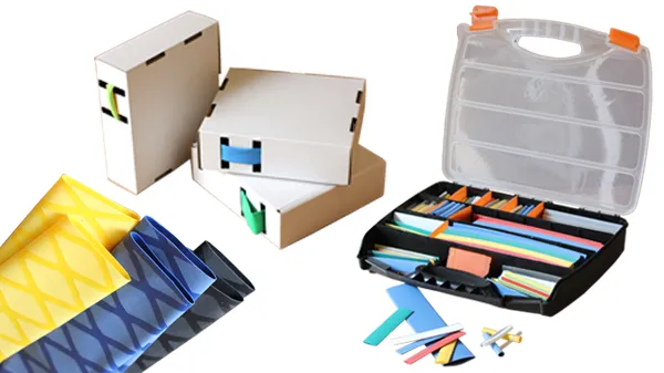 A range of heat shrink products laid out: thin-wall tubing, breakout boots, kits and mastics.