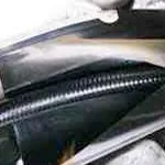 A railed wrap-around sleeve for cable repair.